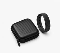 SilentRise Travel Case, black hard-shell zip case beside the SilentRise alarm band on white