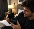 The SilentRise Travel Case open on a hotel bed with the alarm band inside
